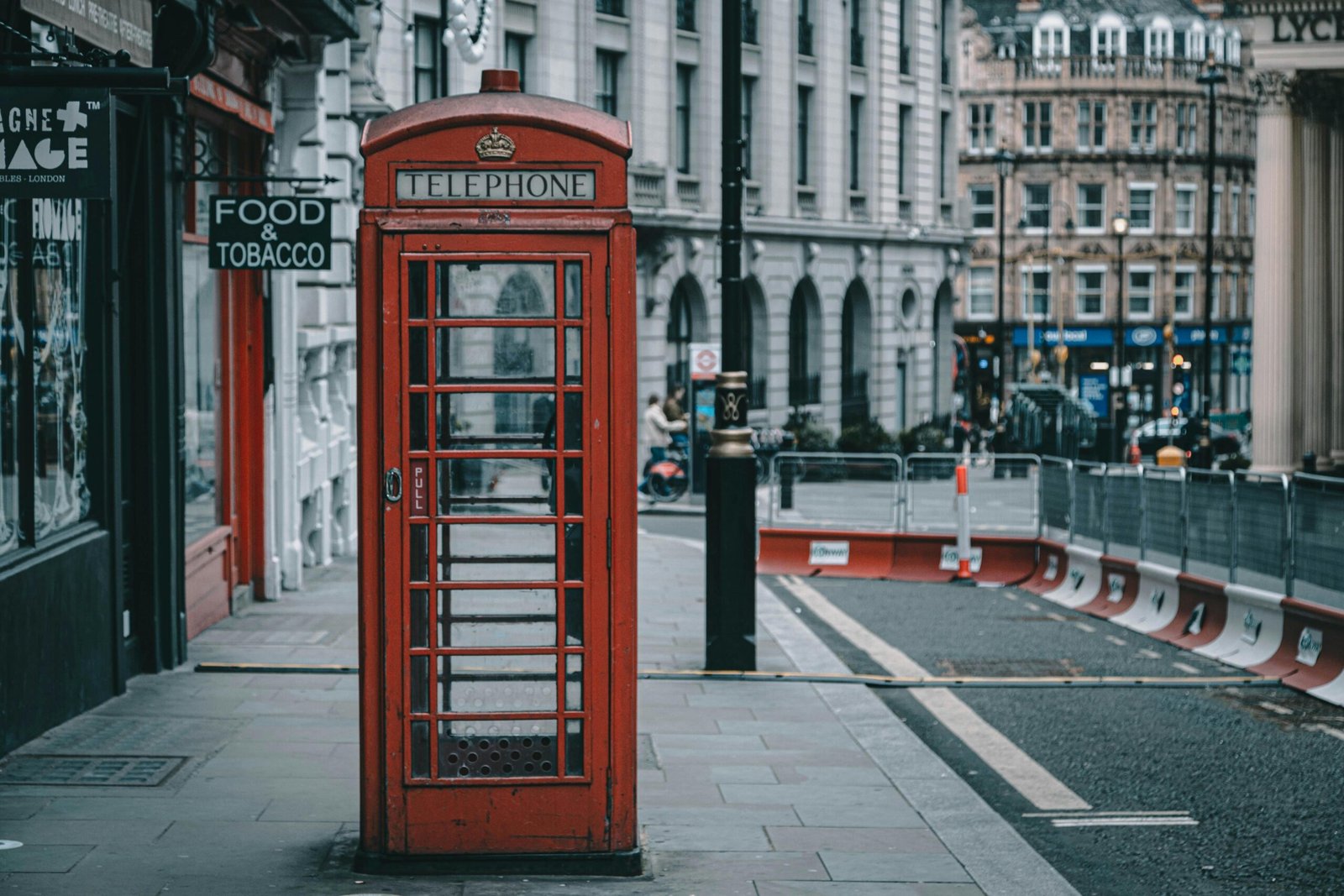 Traditional London red telephone box with the dome of St. Paul's Cathedral.