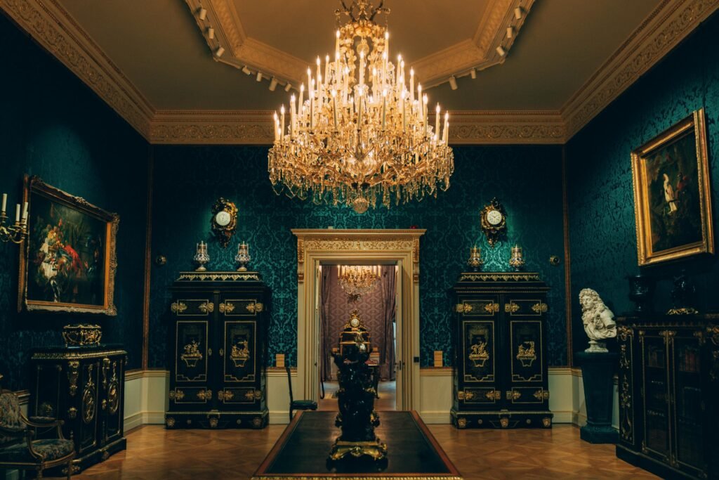 Luxurious vintage room featuring an ornate chandelier and classic furnishings in a London palace.